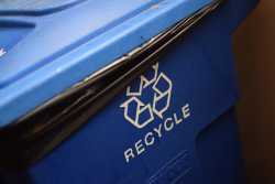 Blue recycle bin close up