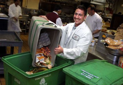 Smiling man composting