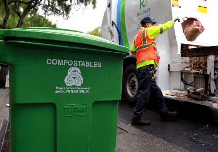 Man near a compost truck