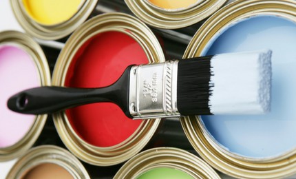 Open cans of paint with brush
