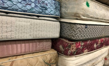Stacks of used mattresses