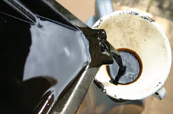 Used oil poured into funnel