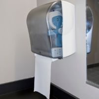 Paper towel dispenser in public bathroom.