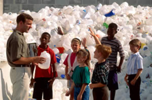 Children at a bottle recycling plant