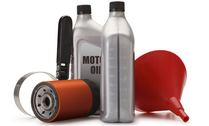 Motor oil bottles, oil filter, oil filter wrench, funnel