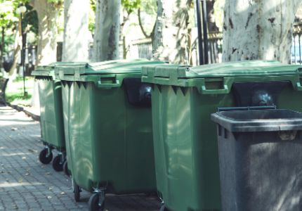 Curbside organics green dumpsters