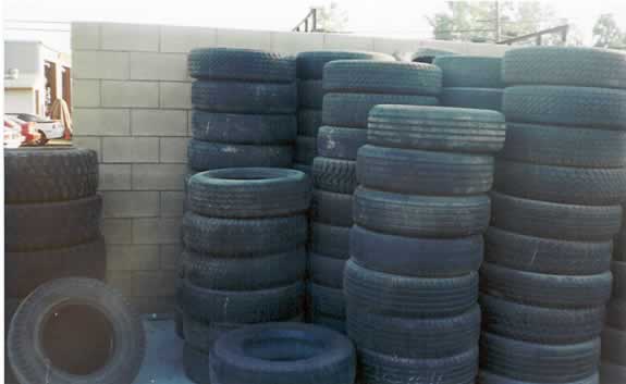 Used and waste tires in vertical barrel stacks