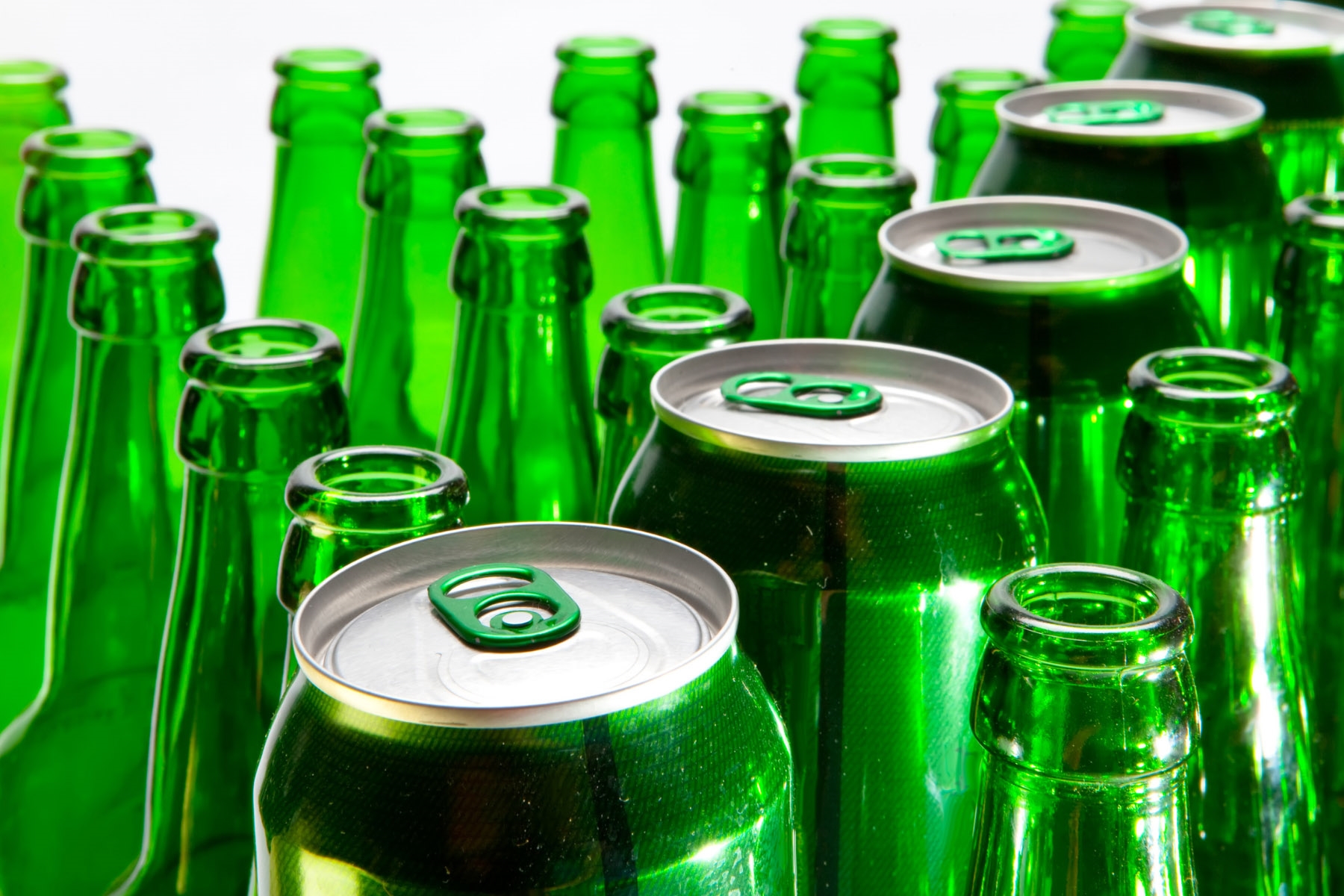 Green bottles and cans close up