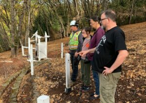 Family looking at debris