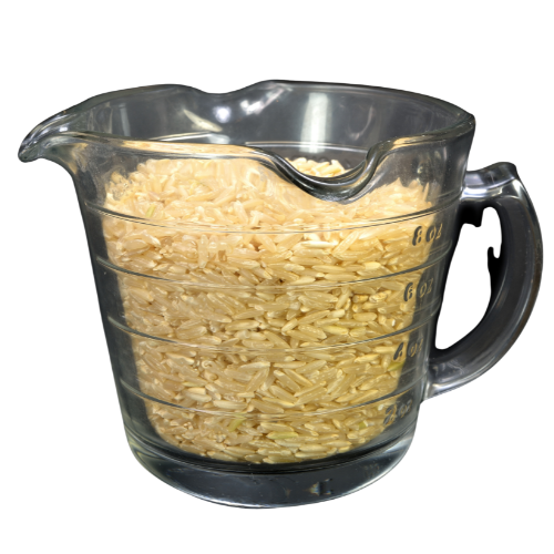 a photo realistic image of a glass measuring cup filled with uncooked rice.